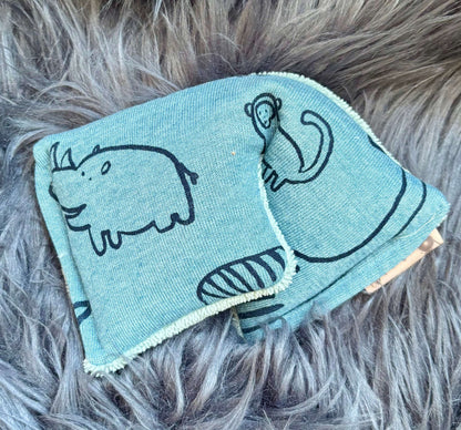 Slaapmasker - verzwarend muntblauw met dino 2de zijde